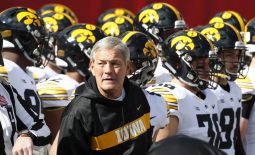 Oct 13, 2018; Bloomington, IN, USA; Iowa Hawkeyes coach Kirk Ferentz waits with his during player introductions before the game against the Indiana Hoosiers at Memorial Stadium . Mandatory Credit: Brian Spurlock-USA TODAY Sports