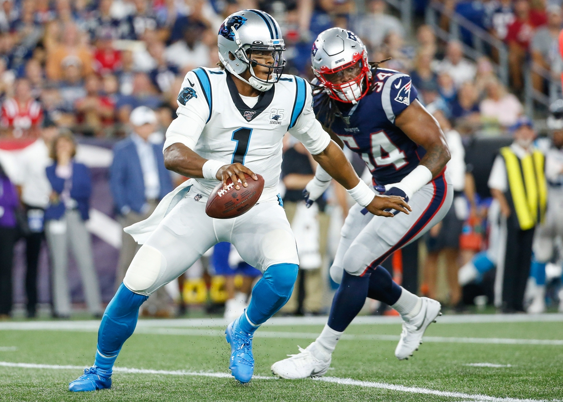 Aug 22, 2019; Foxborough, MA, USA; Carolina Panthers quarterback Cam Newton (1) is forced out of the pocket by New England Patriots outside linebacker Dont'a Hightower (54) during the first half at Gillette Stadium. Mandatory Credit: Greg M. Cooper-USA TODAY Sports