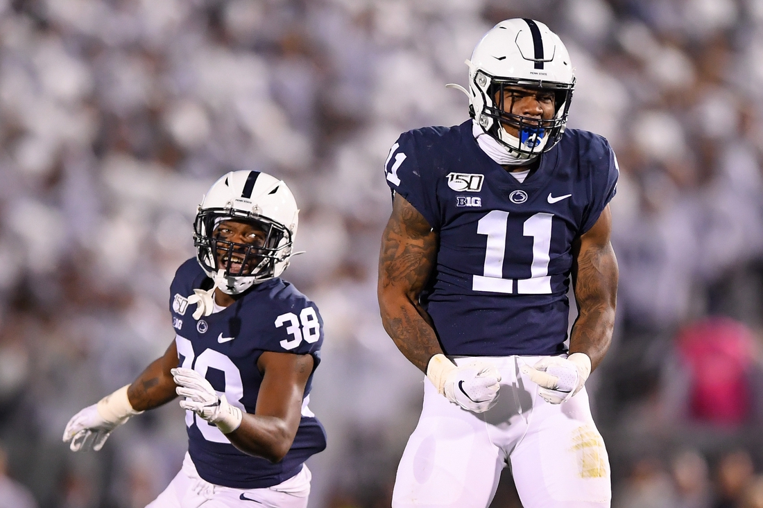 Oct 19, 2019; University Park, PA, USA; Penn State Nittany Lions linebacker Micah Parsons (11) reacts to a defensive play as teammate safety Lamont Wade (38) looks on against the Michigan Wolverines during the second quarter at Beaver Stadium. Mandatory Credit: Rich Barnes-USA TODAY Sports