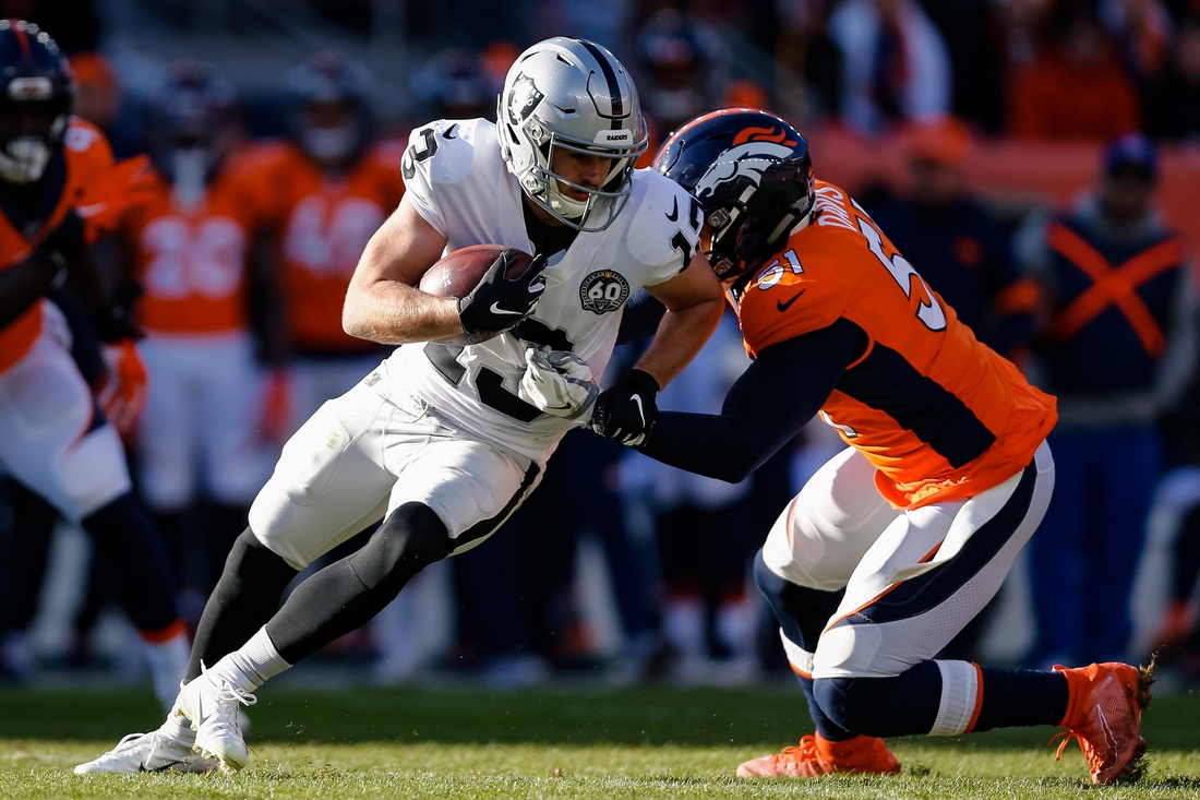 Dec 29, 2019; Denver, Colorado, USA; Oakland Raiders wide receiver Hunter Renfrow (13) is tackled by Denver Broncos inside linebacker Todd Davis (51) in the first quarter at Empower Field at Mile High. Mandatory Credit: Isaiah J. Downing-USA TODAY Sports