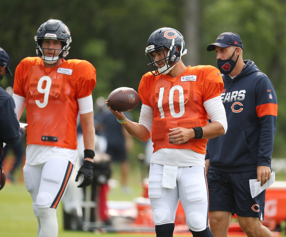 Aug 25, 2020; Lake Forest, IL, USA;   Chicago Bears quarterbacks Nick Foles (9) and Mitch Trubisky (10) and coach Dave Ragone during training camp Tuesday, Aug. 25, 2020 at Halas Hall. Mandatory Credit: Brian Cassella/Pool Photo-USA TODAY Sports