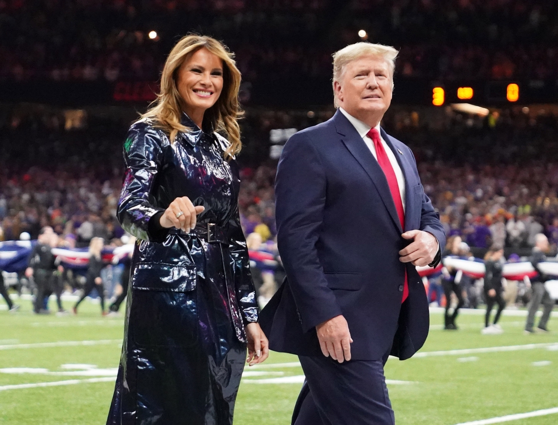 Jan 13, 2020; New Orleans, Louisiana, USA; President Donald J. Trump and First Lady Melania Trump walk off the field before the College Football Playoff national championship game between the Clemson Tigers and the LSU Tigers at Mercedes-Benz Superdome. Mandatory Credit: Kirby Lee-USA TODAY Sports