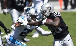 Sep 13, 2020; Charlotte, North Carolina, USA;  Las Vegas Raiders running back Josh Jacobs (28) with the ball as Carolina Panthers safety Jeremy Chinn (21) defends in the second quarter at Bank of America Stadium. Mandatory Credit: Bob Donnan-USA TODAY Sports