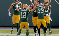 Sep 20, 2020; Green Bay, WI, USA;  Green Bay Packers quarterback Aaron Rodgers (12) and Green Bay Packers running back Aaron Jones (33) celebrate Jones' long touchdown run with teammates during the 3rd quarter of the Green Bay Packers game against the Detroit Lions at Lambeau Field in Green Bay on Sunday, Sept. 20, 2020. Mandatory Credit: Mike De Sisti/Milwaukee Journal Sentinel-USA TODAY NETWORK