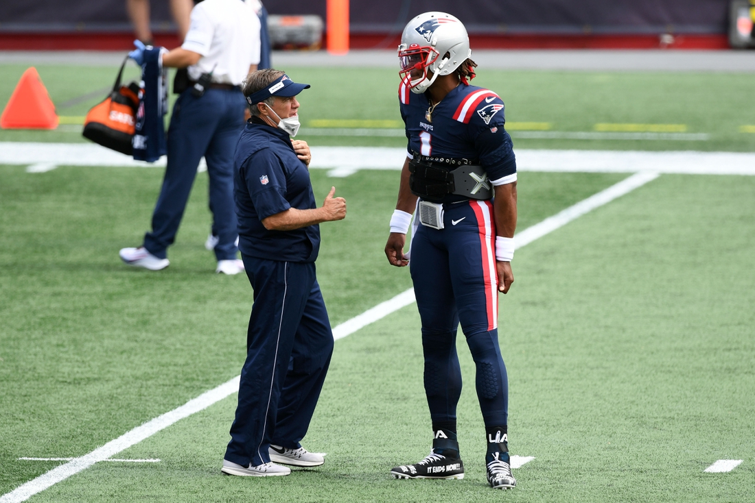 Sep 13, 2020; Foxborough, Massachusetts, USA; New England Patriots head coach Bill Belichick talks with quarterback Cam Newton (1) before a game against the Miami Dolphins at Gillette Stadium. Mandatory Credit: Brian Fluharty-USA TODAY Sports