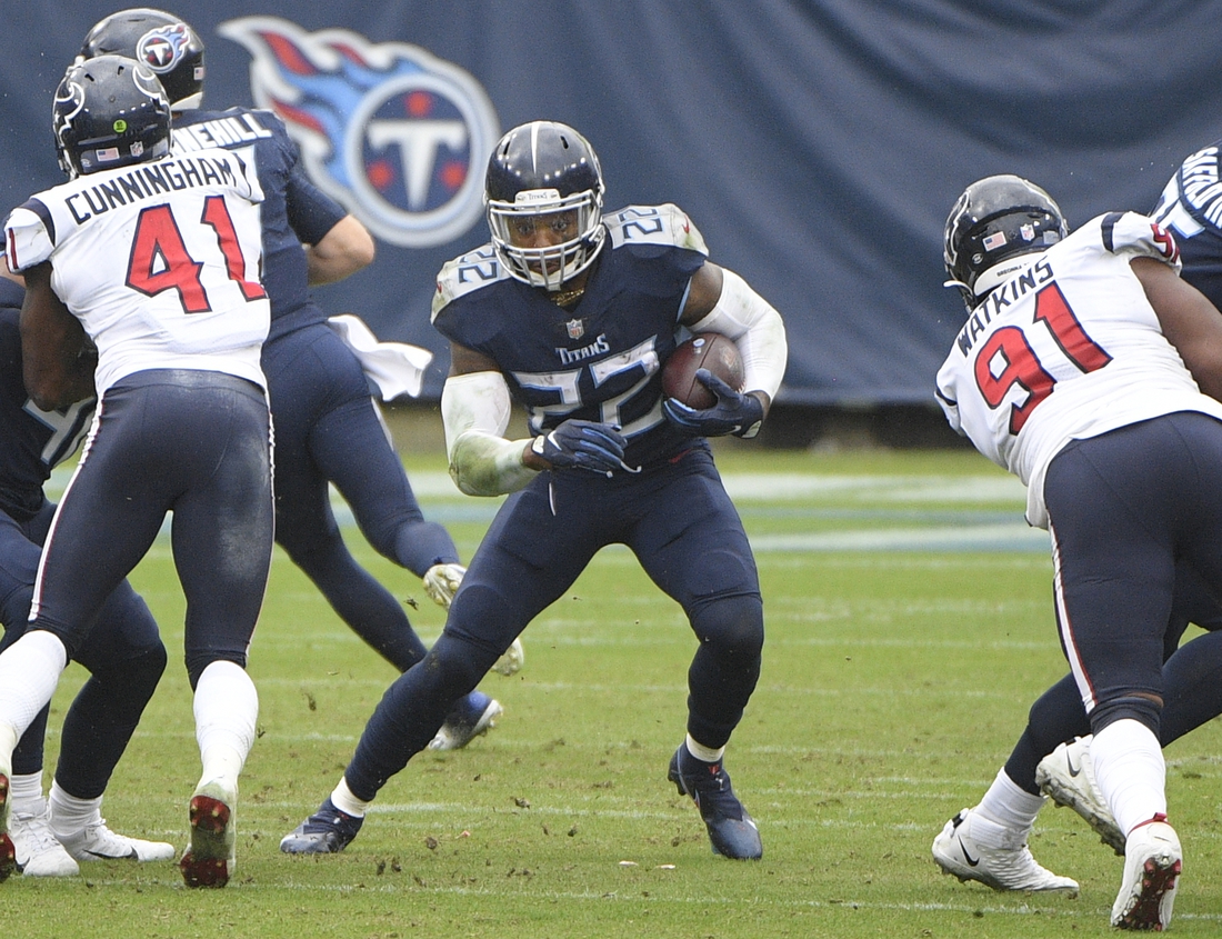 Oct 18, 2020; Nashville, Tennessee, USA; Tennessee Titans running back Derrick Henry (22) runs with the ball against the Houston Texans during second half at Nissan Stadium. Mandatory Credit: Steve Roberts-USA TODAY Sports