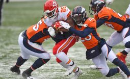 Oct 25, 2020; Denver, Colorado, USA; Kansas City Chiefs running back Clyde Edwards-Helaire (25) rushes for a touchdown past Denver Broncos cornerback Michael Ojemudia (23) in the first quarter at Empower Field at Mile High. Mandatory Credit: Ron Chenoy-USA TODAY Sports