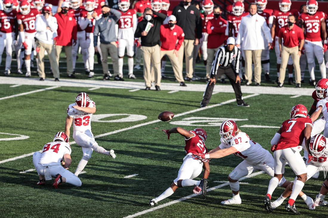 Oct 31, 2020; Piscataway, New Jersey, USA; Indiana Hoosiers place kicker Charles Campbell (93) kicks a field goal held by punter Haydon Whitehead (94) during the first half as Rutgers Scarlet Knights defensive back Tre Avery (21) defends at SHI Stadium. Mandatory Credit: Vincent Carchietta-USA TODAY Sports