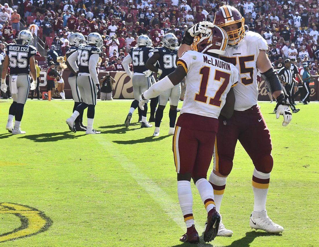 Sep 15, 2019; Landover, MD, USA; Washington Redskins wide receiver Terry McLaurin (17) is congratulated by offensive guard Brandon Scherff (75) after scoring a touchdown against the Dallas Cowboys during the second half at FedExField. Mandatory Credit: Brad Mills-USA TODAY Sports
