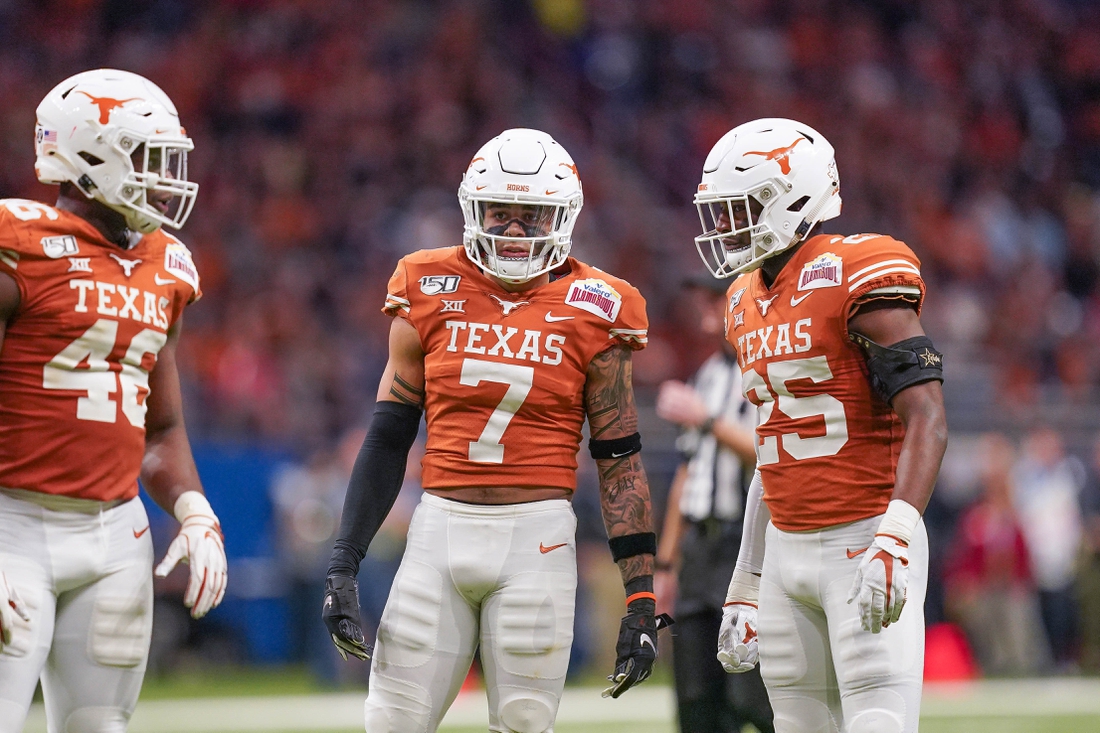 Dec 31, 2019; San Antonio, Texas, USA;  Texas Longhorns linebacker Joseph Ossai (46) and defensive backs Caden Sterns (7) and B.J. Foster (25) in the first half against the Utah Utes at the Alamodome. Mandatory Credit: Daniel Dunn-USA TODAY Sports