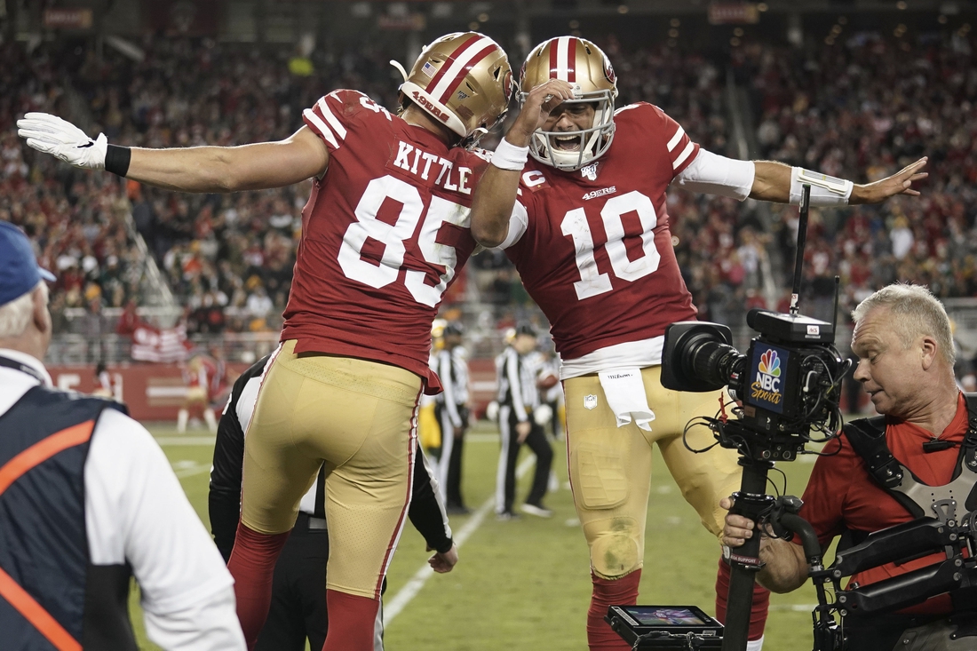 Nov 24, 2019; Santa Clara, CA, USA; San Francisco 49ers tight end George Kittle (85) and quarterback Jimmy Garoppolo (10) celebrate after scoring a touchdown against the Green Bay Packers during the third quarter at Levi's Stadium. Mandatory Credit: Stan Szeto-USA TODAY Sports