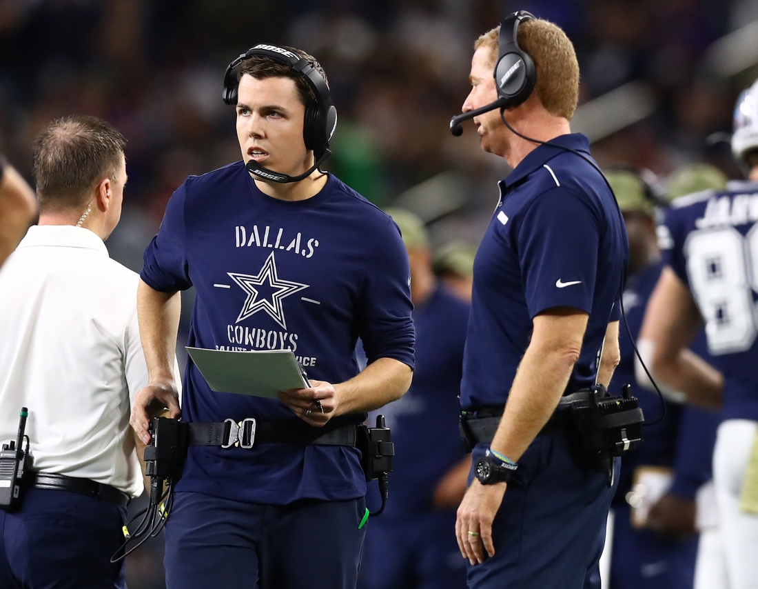 Nov 10, 2019; Arlington, TX, USA; Dallas Cowboys offensive coordinator Kellen Moore with head coach Jason Garrett on the sidelines during the game against the Minnesota Vikings at AT&T Stadium. Mandatory Credit: Matthew Emmons-USA TODAY Sports