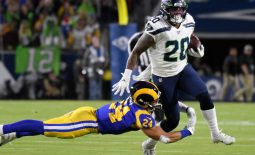 Dec 8, 2019; Los Angeles, CA, USA; Los Angeles Rams safety Taylor Rapp (24) makes a diving tackle on Seattle Seahawks running back Rashaad Penny (20) in the first quarter  at Los Angeles Memorial Coliseum. Mandatory Credit: Robert Hanashiro-USA TODAY Sports