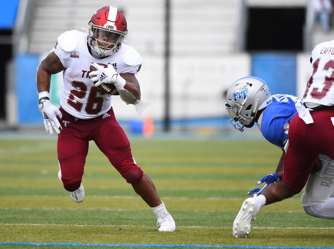 Sep 19, 2020; Murfreesboro, Tennessee, USA; Troy Trojans running back B.J. Smith (26) runs for a first down during the first half against the Middle Tennessee Blue Raiders at Floyd Stadium.  Mandatory Credit: Christopher Hanewinckel-USA TODAY Sports