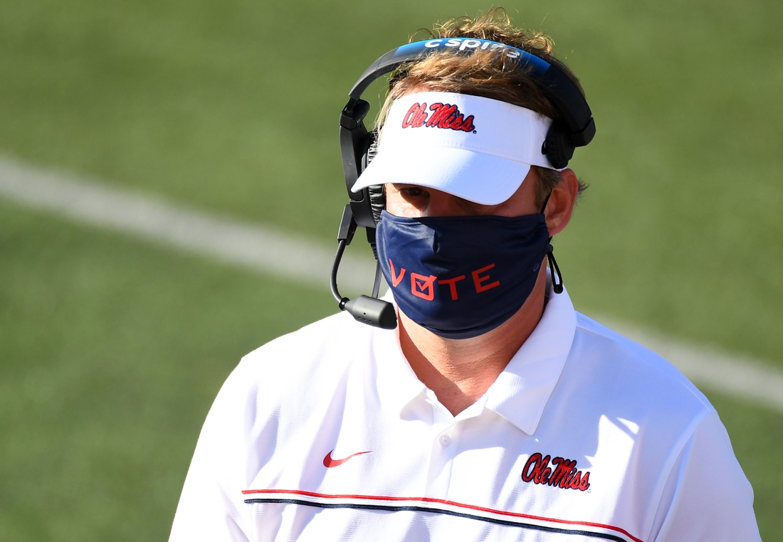 Oct 31, 2020; Nashville, Tennessee, USA; Mississippi Rebels head coach Lane Kiffin wears a mask with the word vote printed on the front during the first half against the Vanderbilt Commodores at Vanderbilt Stadium. Mandatory Credit: Christopher Hanewinckel-USA TODAY Sports