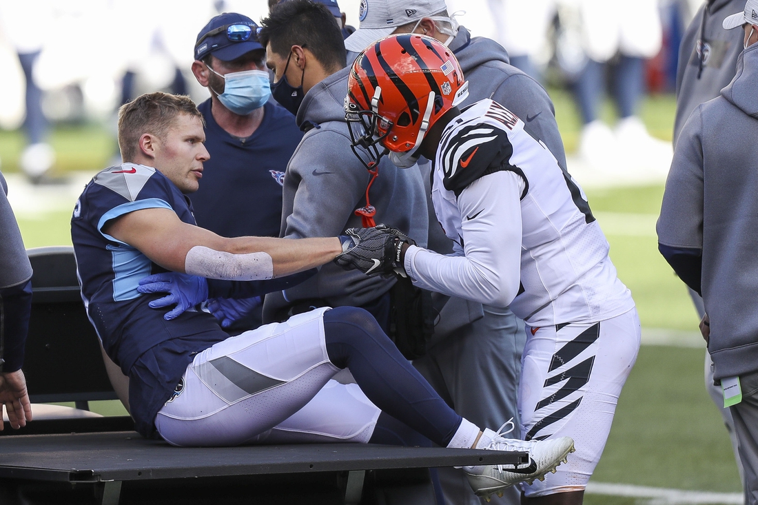 Nov 1, 2020; Cincinnati, Ohio, USA; Tennessee Titans wide receiver Adam Humphries (10) shakes hands with Cincinnati Bengals cornerback Mackensie Alexander (21) before being carted off the field after suffering an apparent injury in the first half at Paul Brown Stadium. Mandatory Credit: Katie Stratman-USA TODAY Sports