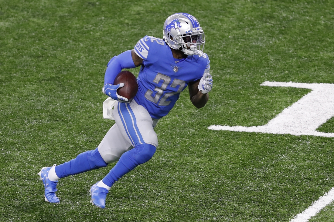 Nov 15, 2020; Detroit, Michigan, USA; Detroit Lions running back D'Andre Swift (32) runs after a catch for a touchdown during the third quarter against the Washington Football Team at Ford Field. Mandatory Credit: Raj Mehta-USA TODAY Sports
