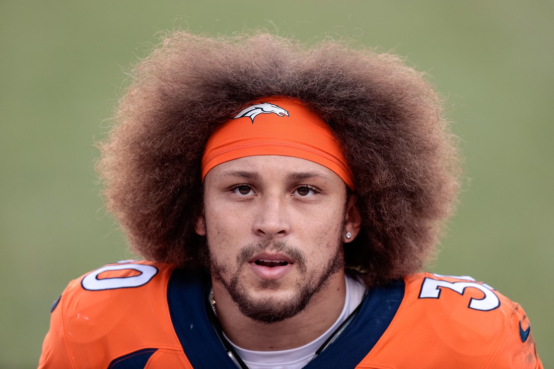 Nov 1, 2020; Denver, Colorado, USA; Denver Broncos running back Phillip Lindsay (30) in the second quarter against the Los Angeles Chargers at Empower Field at Mile High. Mandatory Credit: Isaiah J. Downing-USA TODAY Sports