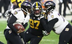 Dec 2, 2020; Pittsburgh, Pennsylvania, USA;  Baltimore Ravens quarterback Robert Griffin III (3) runs the ball as offensive guard Tyre Phillips (74) blocks Pittsburgh Steelers defensive end Cameron Heyward (97) during the second quarter at Heinz Field. Mandatory Credit: Charles LeClaire-USA TODAY Sports