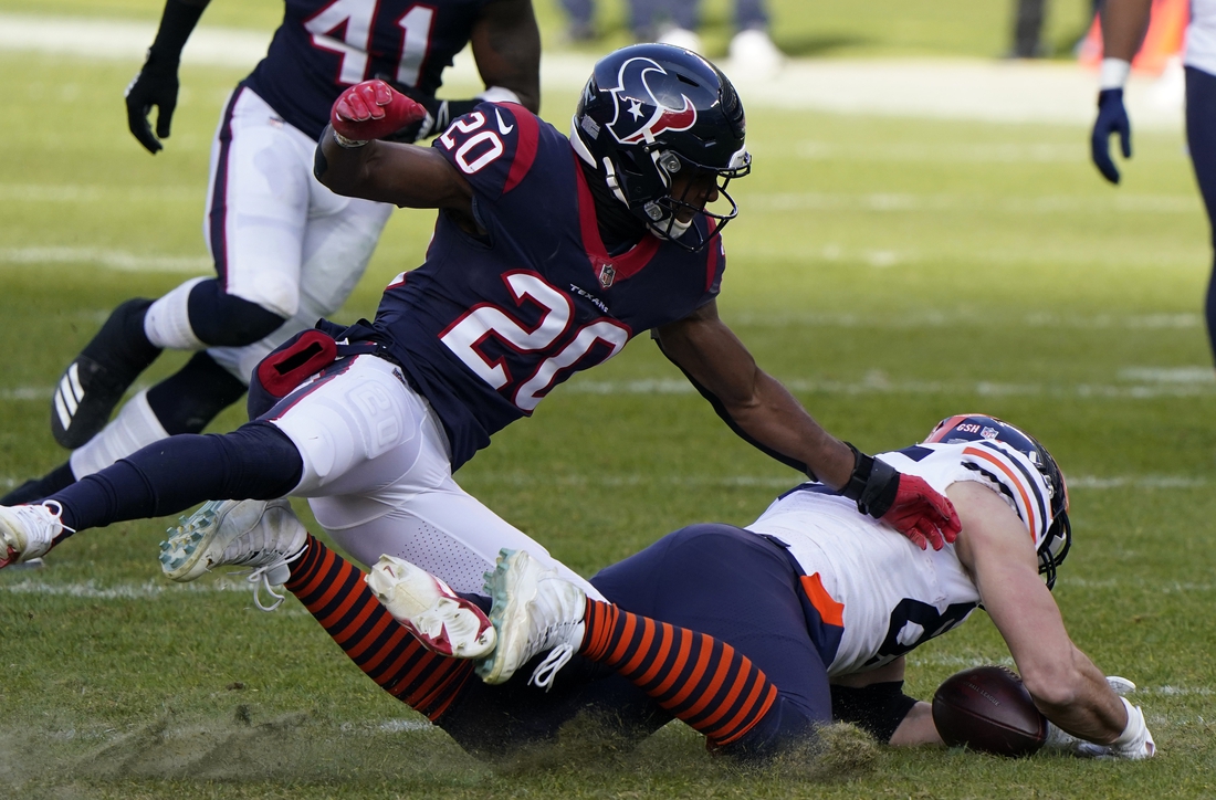 Dec 13, 2020; Chicago, Illinois, USA; Chicago Bears tight end Cole Kmet (85) attempts to make a catch against Houston Texans strong safety Justin Reid (20) during the third quarter at Soldier Field. Mandatory Credit: Mike Dinovo-USA TODAY Sports