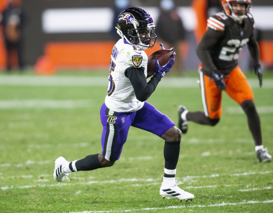 Dec 14, 2020; Cleveland, Ohio, USA; Baltimore Ravens wide receiver Marquise Brown (15) runs the ball for a touchdown following his reception against the Cleveland Browns during the fourth quarter at FirstEnergy Stadium. Mandatory Credit: Scott Galvin-USA TODAY Sports