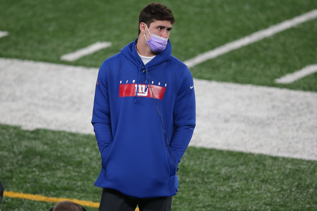 Dec 20, 2020; East Rutherford, New Jersey, USA; New York Giants injured quarterback Daniel Jones (8) on the sidelines during the third quarter against the Cleveland Browns at MetLife Stadium. Mandatory Credit: Brad Penner-USA TODAY Sports