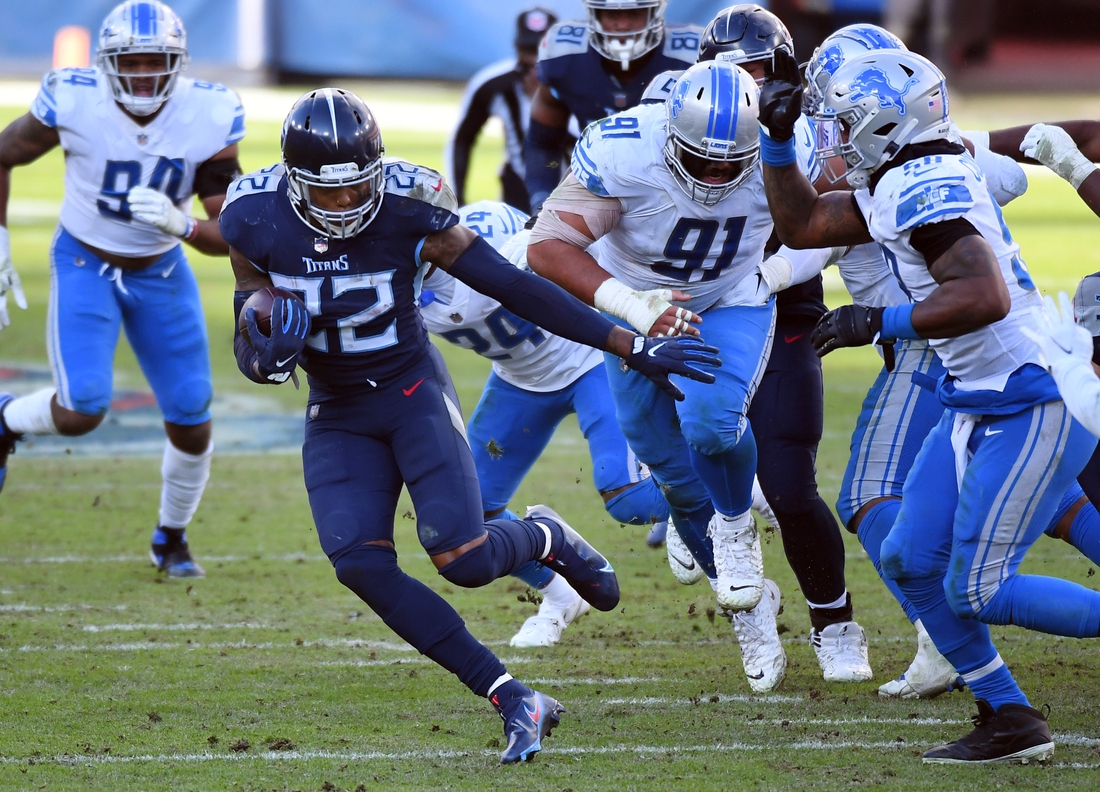 Dec 20, 2020; Nashville, Tennessee, USA; Tennessee Titans running back Derrick Henry (22) runs for a first down during the second half against the Detroit Lions at Nissan Stadium. Mandatory Credit: Christopher Hanewinckel-USA TODAY Sports