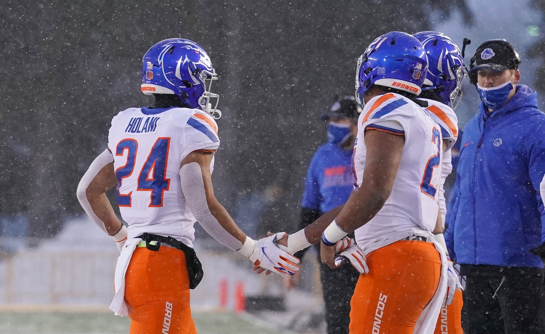 Dec 12, 2020; Laramie, Wyoming, USA; Boise State Broncos running back George Holani (24) celebrates a touchdown against the Wyoming Cowboys during the first quarter at Jonah Field at War Memorial Stadium. Mandatory Credit: Troy Babbitt-USA TODAY Sports