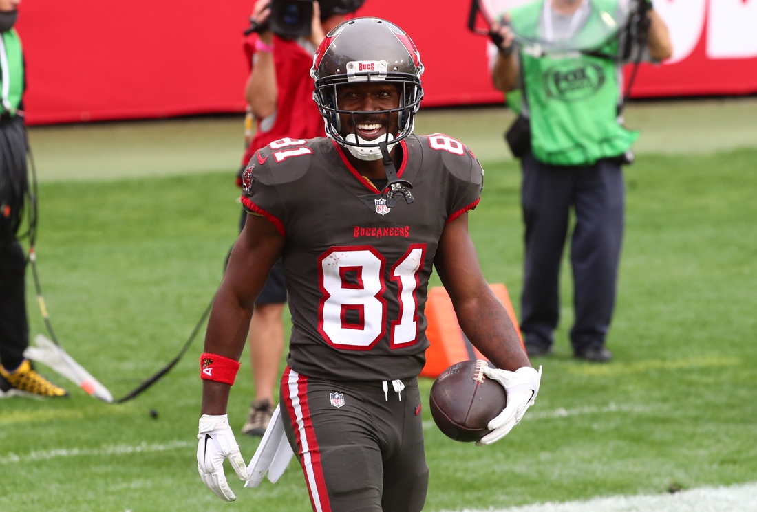 Jan 3, 2021; Tampa, Florida, USA; Tampa Bay Buccaneers wide receiver Antonio Brown (81) smiles after scoring a touchdown against the Atlanta Falcons during the second half at Raymond James Stadium. Mandatory Credit: Kim Klement-USA TODAY Sports