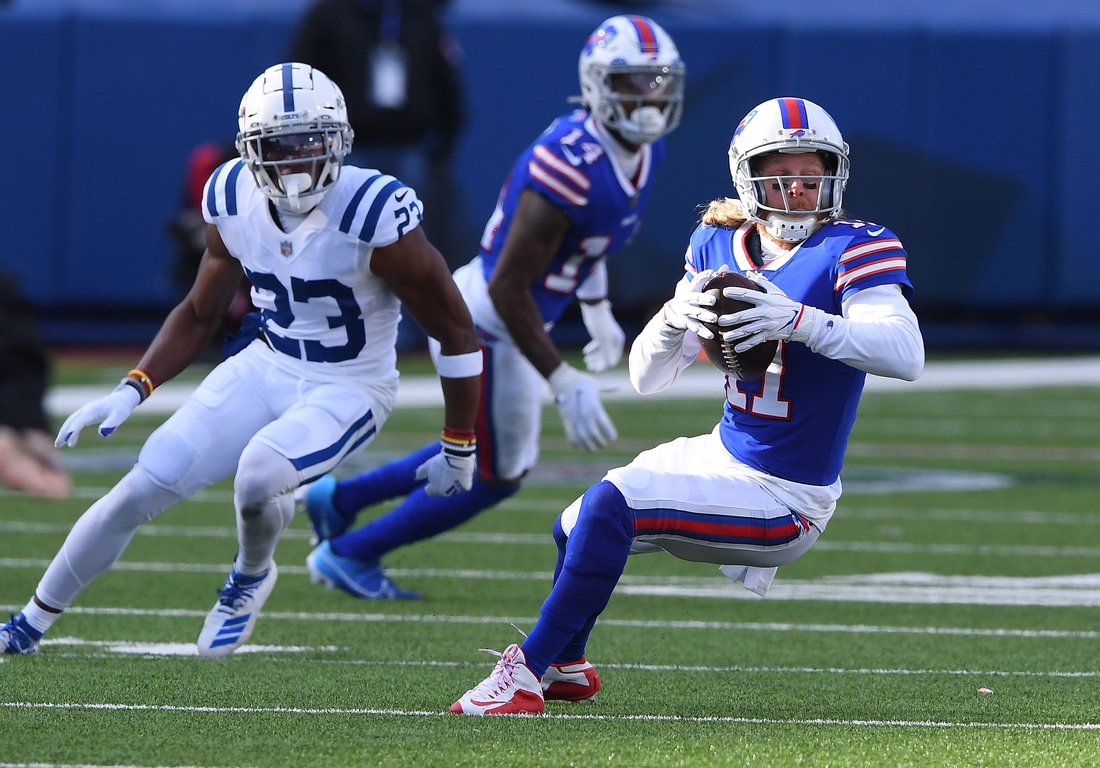 Jan 9, 2021; Orchard Park, New York, USA; Buffalo Bills wide receiver Cole Beasley (11) runs the ball against the Indianapolis Colts during the first half in the AFC Wild Card game at Bills Stadium. Mandatory Credit: Rich Barnes-USA TODAY Sports