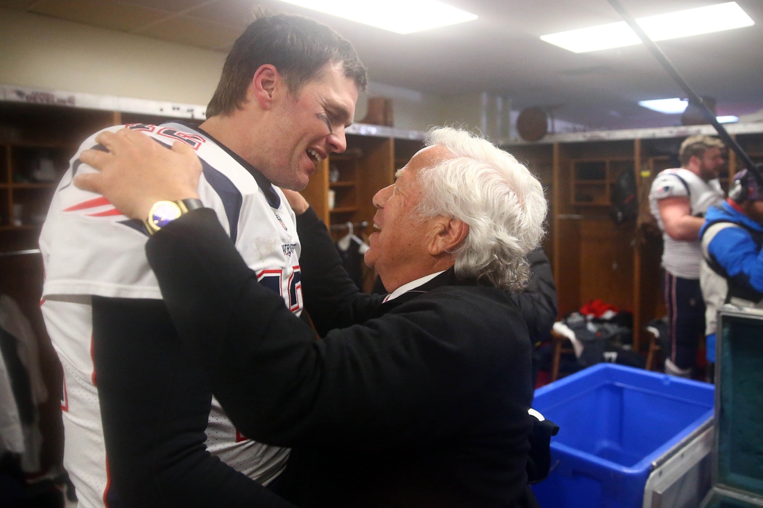 Jan 20, 2019; Kansas City, MO, USA; New England Patriots quarterback Tom Brady (12) greets owner Robert Kraft in the locker room as they celebrate their win over the Kansas City Chiefs during overtime in the AFC Championship game at Arrowhead Stadium. Mandatory Credit: Mark Rebilas-USA TODAY Sports