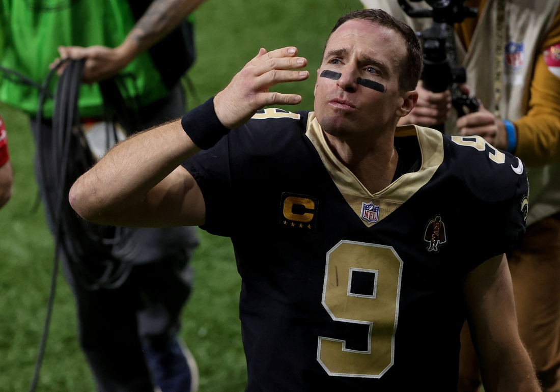 Jan 17, 2021; New Orleans, Louisiana, USA; New Orleans Saints quarterback Drew Brees (9) blows a kiss to his family as he walks to the tunnel following a 30-20 loss against the Tampa Bay Buccaneers in a NFC Divisional Round playoff game at the Mercedes-Benz Superdome. Mandatory Credit: Derick E. Hingle-USA TODAY Sports