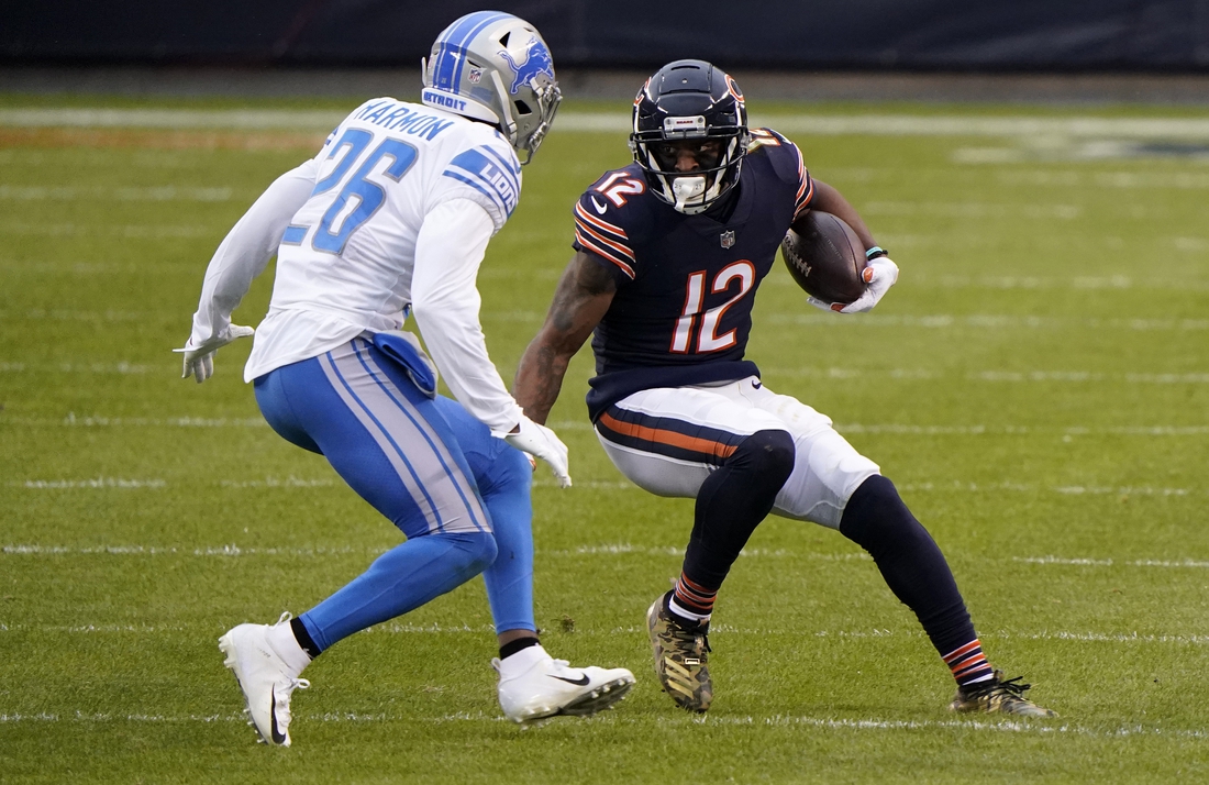 Dec 6, 2020; Chicago, Illinois, USA; Chicago Bears wide receiver Allen Robinson (12) makes a catch against Detroit Lions strong safety Duron Harmon (26) during the second quarter at Soldier Field. Mandatory Credit: Mike Dinovo-USA TODAY Sports