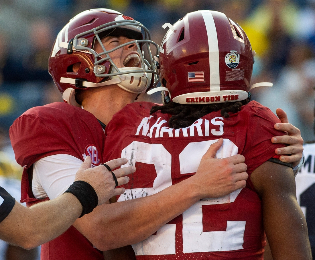 Alabama quarterback Mac Jones (10) his Alabama running back Najee Harris (22) after Harris' late touchdown against Michigan in the Citrus Bowl in Orlando, Fla., on Wednesday January 1, 2020.

Cit24