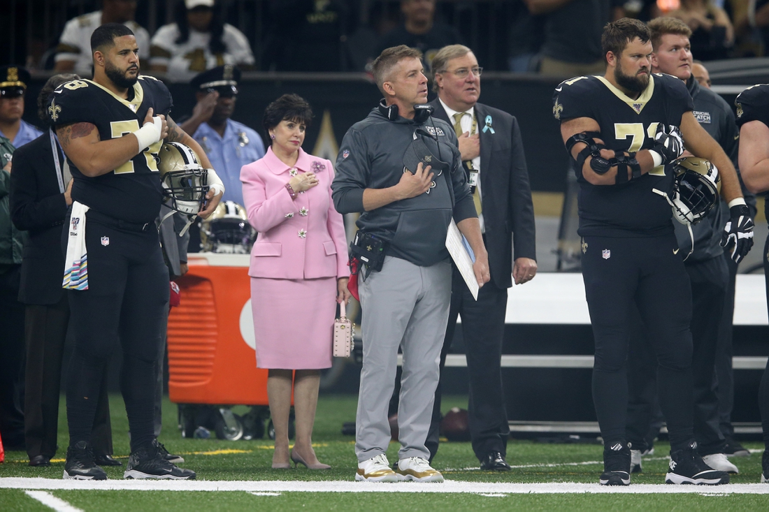 Oct 6, 2019; New Orleans, LA, USA; New Orleans Saints head coach Sean Payton stands during the National Anthem with team owner Gayle Benson (middle left) and team president Dennis Lauscha (middle right) before a game against the Tampa Bay Buccaneers at the Mercedes-Benz Superdome. Mandatory Credit: Chuck Cook-USA TODAY Sports