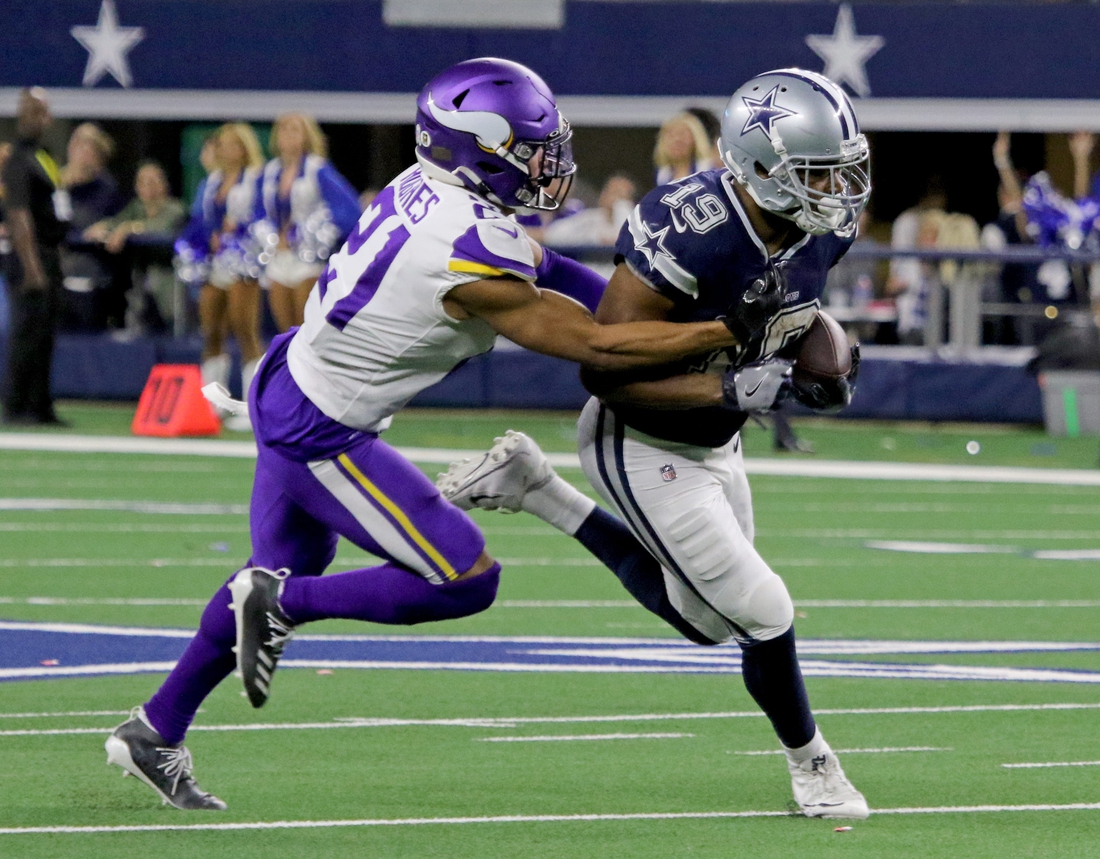 Dallas Cowboys' Amari Cooper is tackled by Minnesota Vikings' Mike Hughes Sunday, Nov. 10, 2019, at AT&T Stadium in Arlington. The Vikings defeated the Cowboys 28-24.Nfl Dallas Cowboys Minnesota Vikings