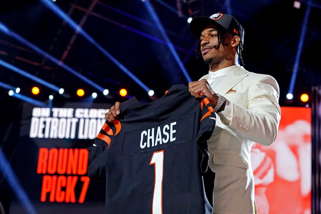 Apr 29, 2021; Cleveland, Ohio, USA; Ja'Marr Chase (LSU) poses with a jersey after being selected by Cincinnati Bengals as the number five overall pick in the first round of the 2021 NFL Draft at First Energy Stadium. Mandatory Credit: Kirby Lee-USA TODAY Sports