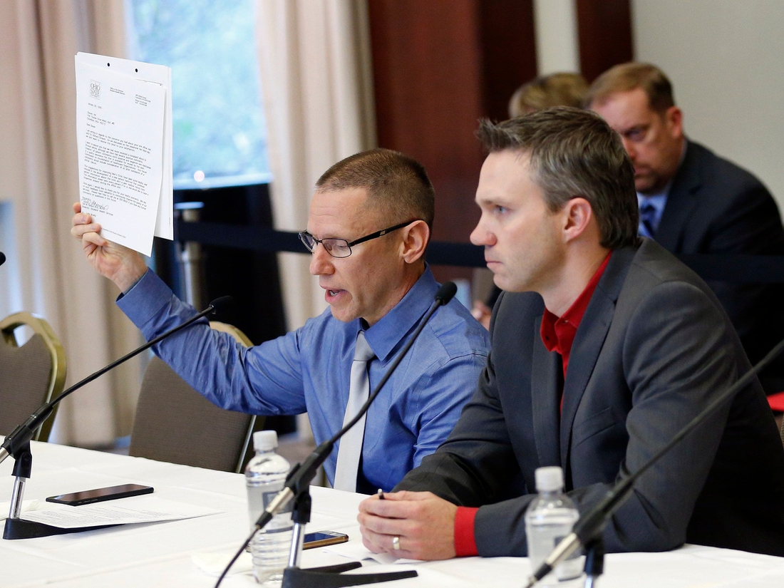 Victims of Dr. Richard Strauss, Brian Garrett, right, listens as Stephen Snyder Hill holds a document from Student Health Services while testifying to the extent of their abuse during an Ohio State University Board of Trustees meeting at the Longaberger Alumni House on Nov. 16, 2018.

Mt Trustees Ac 10