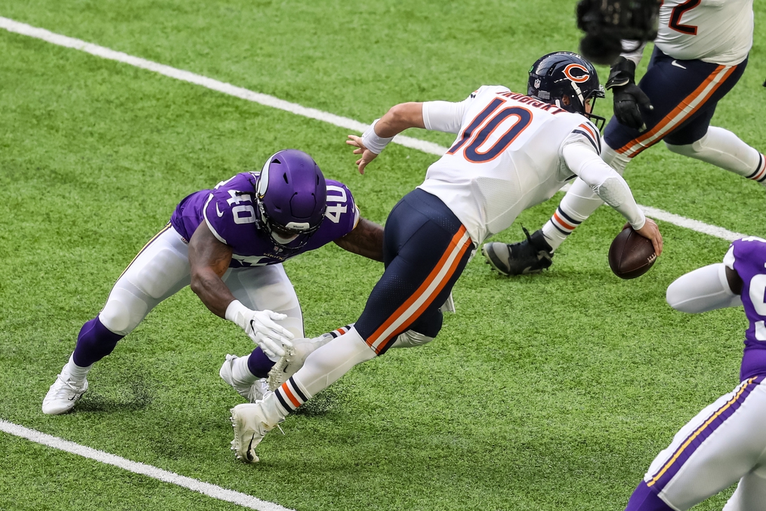 Dec 20, 2020; Minneapolis, Minnesota, USA; Chicago Bears quarterback Mitchell Trubisky (10) is sacked by Minnesota Vikings linebacker Todd Davis (40) during the first quarter at U.S. Bank Stadium. Mandatory Credit: Brace Hemmelgarn-USA TODAY Sports