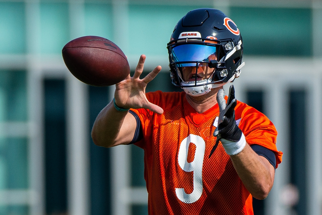 Jul 29, 2021; Lake Forest, IL, USA; Chicago Bears quarterback Nick Foles (9) catches the ball during a Chicago Bears training camp session at Halas Hall. Mandatory Credit: Jon Durr-USA TODAY Sports
