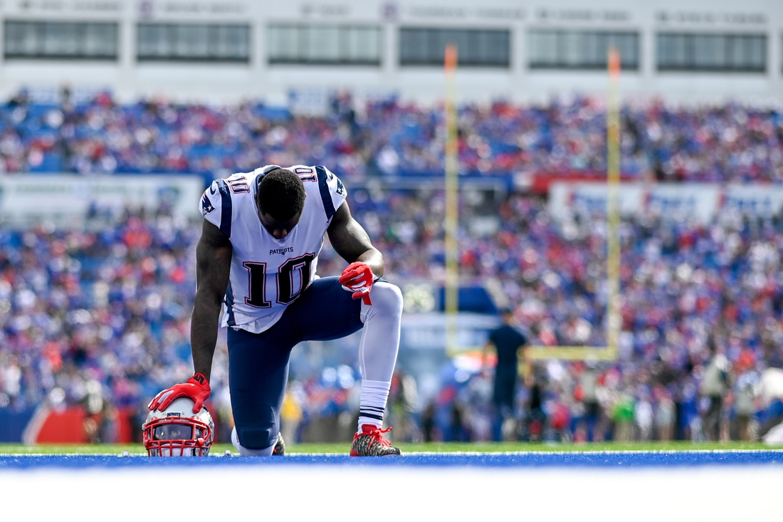 Sep 29, 2019; Orchard Park, NY, USA; New England Patriots wide receiver Josh Gordon (10) takes a knee in the end zone prior to the game between the Buffalo Bills and the New England Patriots at New Era Field. Mandatory Credit: Douglas DeFelice-USA TODAY Sports