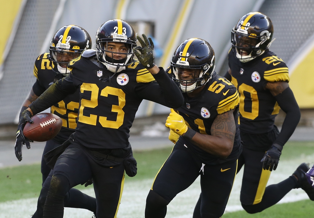 Dec 2, 2020; Pittsburgh, Pennsylvania, USA;  Pittsburgh Steelers cornerback Joe Haden (23) celebrates his fourteen yard interception return for a touchdown with teammates against the Baltimore Ravens during the first quarter at Heinz Field. Mandatory Credit: Charles LeClaire-USA TODAY Sports
