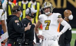 Dec 25, 2020; New Orleans, Louisiana, USA; New Orleans Saints quarterback Taysom Hill (7) talks to head coach Sean Payton and offensive coordinator Pete Carmichael in the second quarter at the Mercedes-Benz Superdome. Mandatory Credit: Chuck Cook-USA TODAY Sports