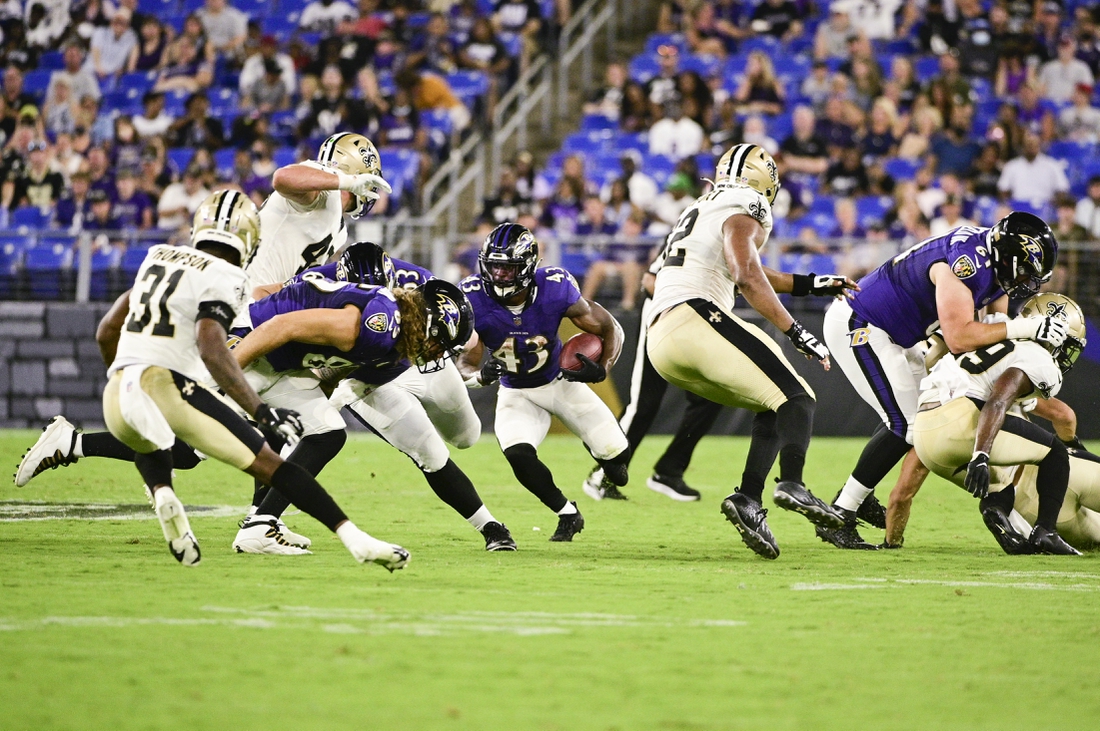 Aug 14, 2021; Baltimore, Maryland, USA;  Baltimore Ravens running back Justice Hill (43) rushes during the first half against the New Orleans Saints at M&T Bank Stadium. Mandatory Credit: Tommy Gilligan-USA TODAY Sports