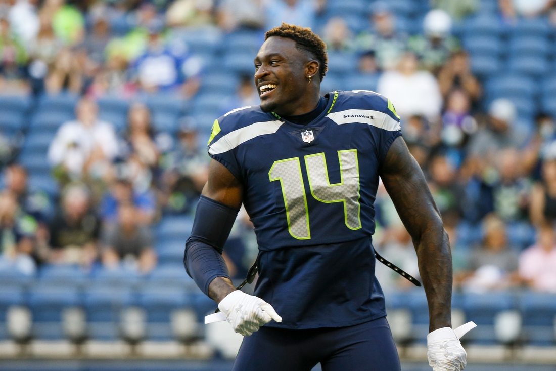 Aug 28, 2021; Seattle, Washington, USA; Seattle Seahawks wide receiver DK Metcalf (14) returns to the locker room following warmups before a game against the Los Angeles Chargers at Lumen Field. Mandatory Credit: Joe Nicholson-USA TODAY Sports