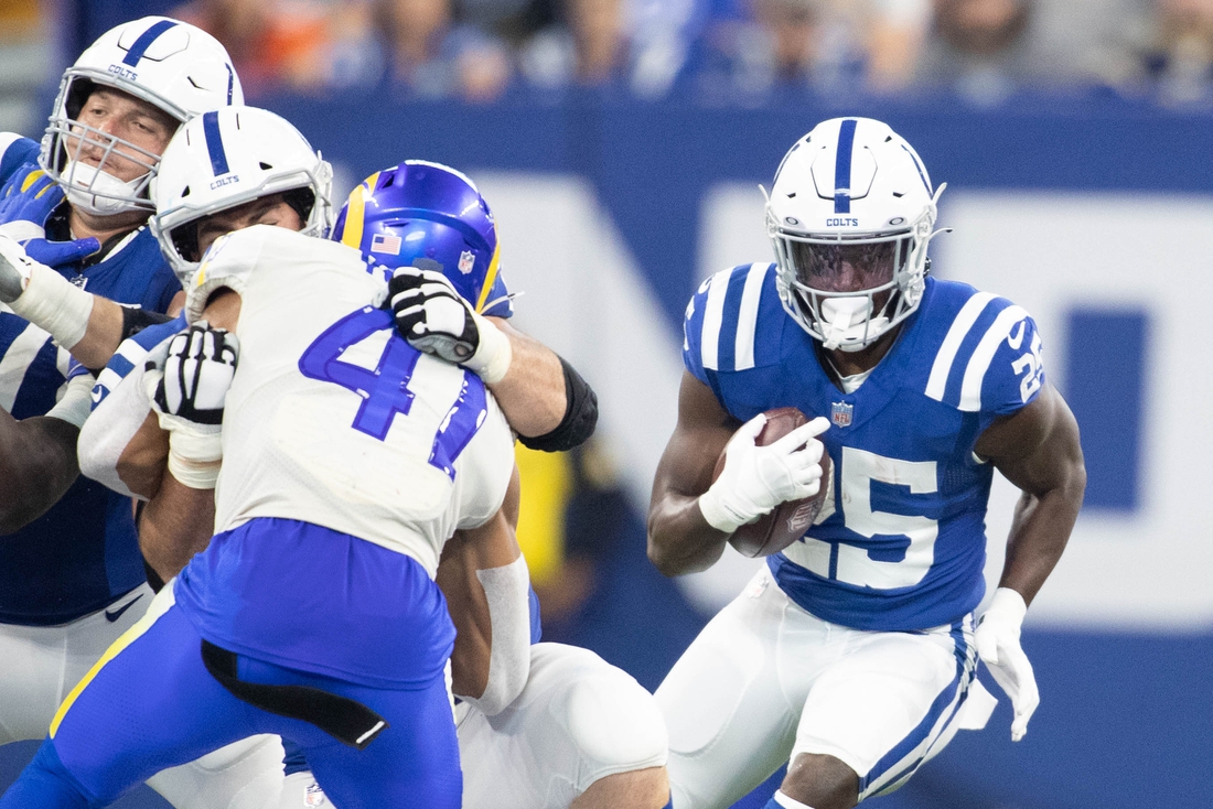 Sep 19, 2021; Indianapolis, Indiana, USA; Indianapolis Colts running back Marlon Mack (25) runs the ball in the second half against the Los Angeles Rams at Lucas Oil Stadium. Mandatory Credit: Trevor Ruszkowski-USA TODAY Sports