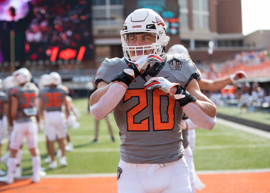 Sep 11, 2021; Stillwater, Oklahoma, USA; Oklahoma State Cowboys linebacker Malcolm Rodriguez (20) warms up before the game against the Tulsa Golden Hurricane at Boone Pickens Stadium. Mandatory Credit: Brett Rojo-USA TODAY Sports