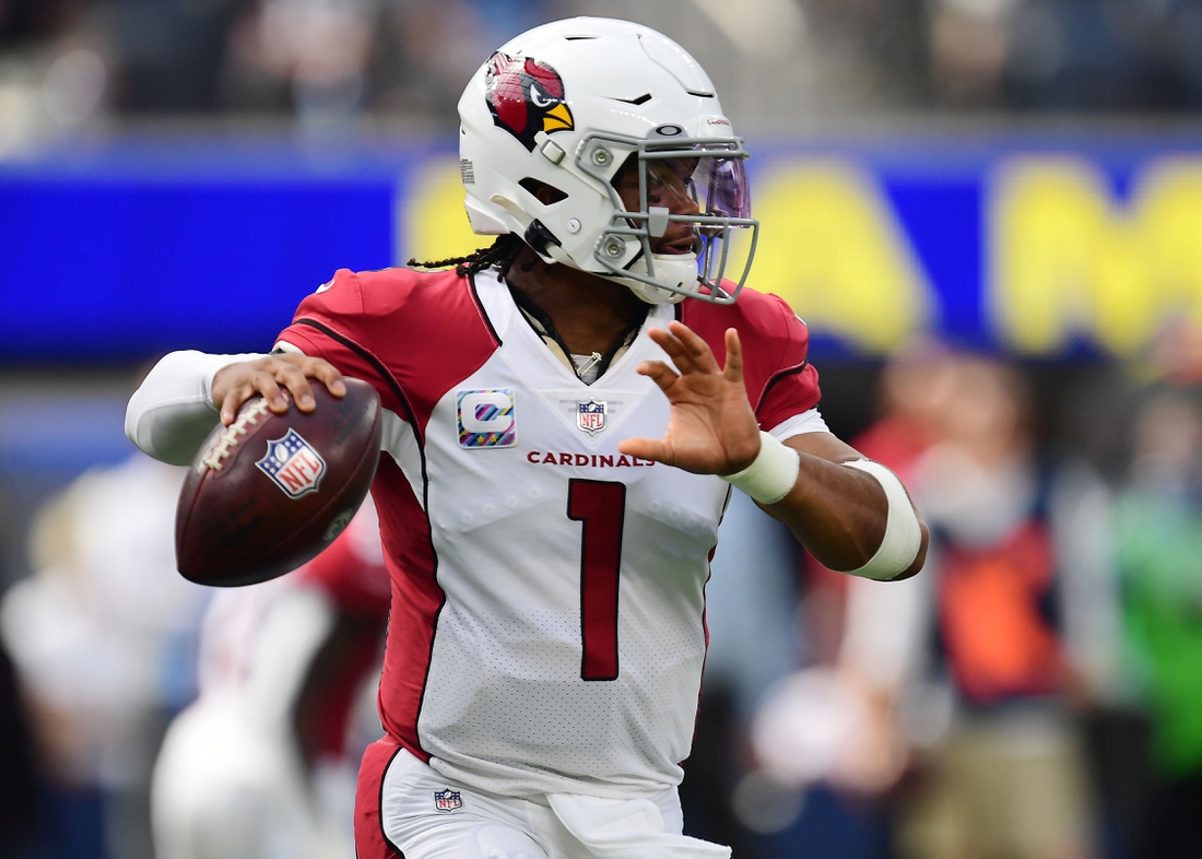 Oct 3, 2021; Inglewood, California, USA; Arizona Cardinals quarterback Kyler Murray (1) moves out to pass against the Los Angeles Rams during the first half at SoFi Stadium. Mandatory Credit: Gary A. Vasquez-USA TODAY Sports