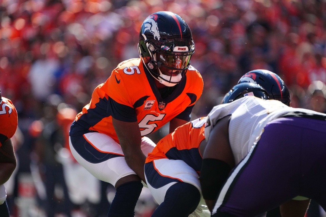 Oct 3, 2021; Denver, Colorado, USA; Denver Broncos quarterback Teddy Bridgewater (5) during the first quarter against the Baltimore Ravens at Empower Field at Mile High. Mandatory Credit: Ron Chenoy-USA TODAY Sports