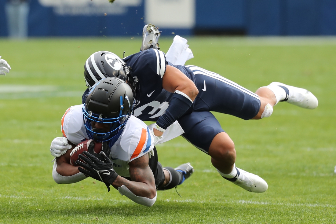 Oct 9, 2021; Provo, Utah, USA; Boise State Broncos wide receiver Octavius Evans (1) is tackled by Brigham Young Cougars linebacker Chaz Ah You (3) during the first quarter at LaVell Edwards Stadium. Mandatory Credit: Rob Gray-USA TODAY Sports